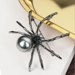 Broche araignée avec perle